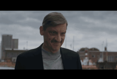Man with Mustache Smiling City Skyline