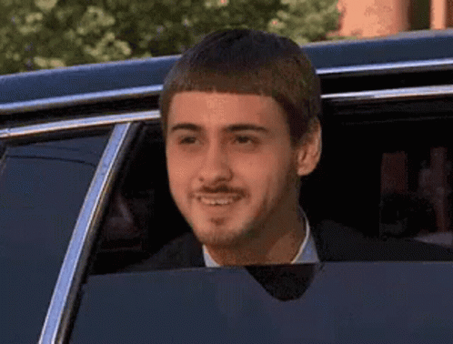 Man with Mustache Smiling in Limousine