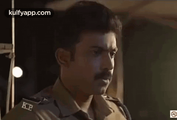 Man With Mustache Smoking Cigarette In Dark Room GIF