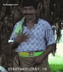 Man With Mustache Standing By Tree GIF