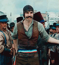 Man With Mustache Standing in Front of Group