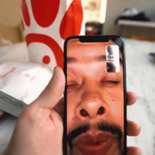 Man With Mustache Taking Selfie
