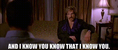 Man with Mustache Talking on Couch