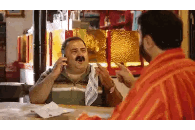 Man with Mustache Talking on Phone