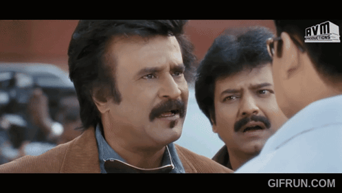 Man With Mustache Talking To Another Man GIF