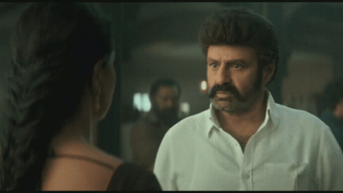 Man With Mustache Talking To Woman GIF