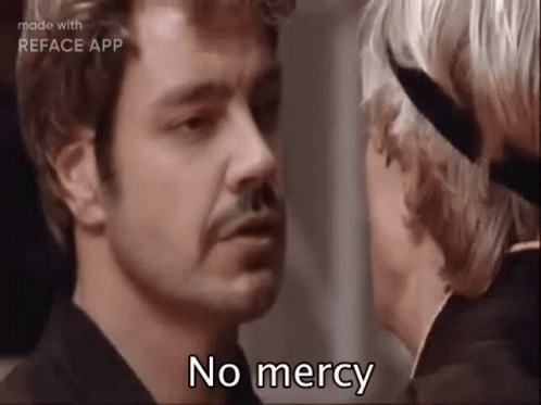 Man With Mustache Talking To Woman With Knife GIF
