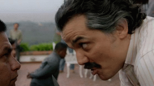 Man With Mustache Watching Knife Man