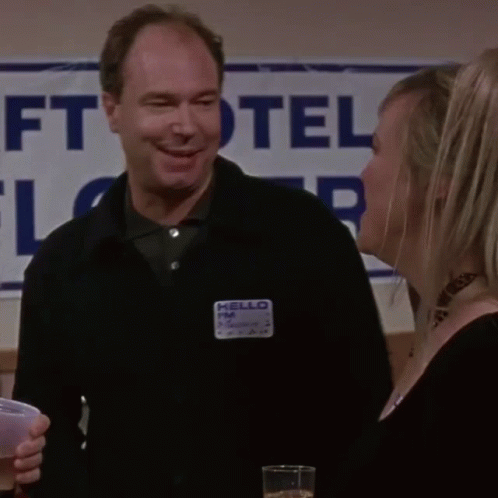 Man with Name Tag Saying Hello FM