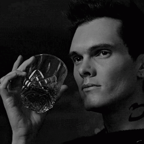 Man With Neck Tattoo Holding Glass Of Whiskey GIF