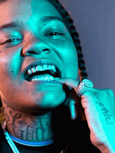 Man With Neck Tattoo Saying God