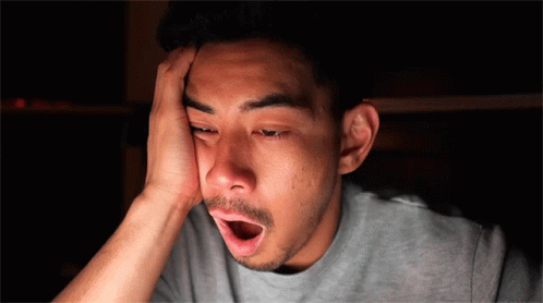 Man With Open Mouth Hand on Forehead