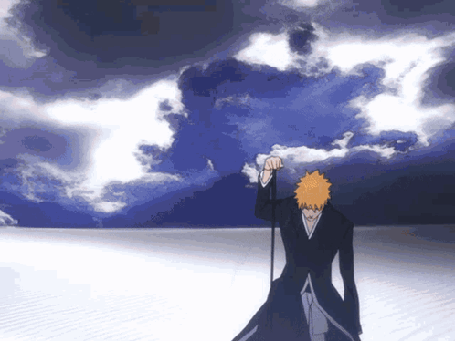 Man With Orange Hair Standing in Front of Cloudy Blue Sky