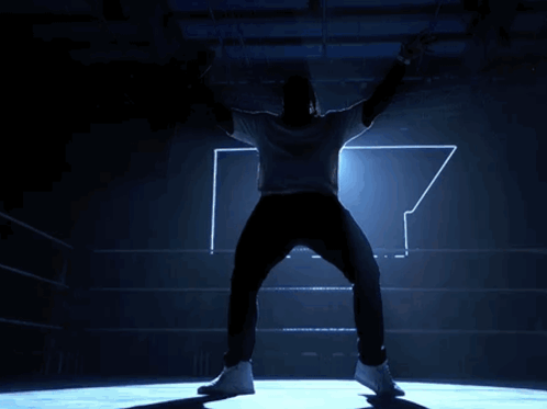 Man With Outstretched Arms in Boxing Ring
