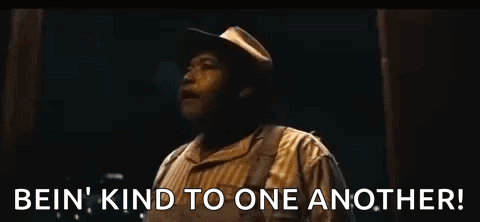 Man With Outstretched Arms Saying Be Kind