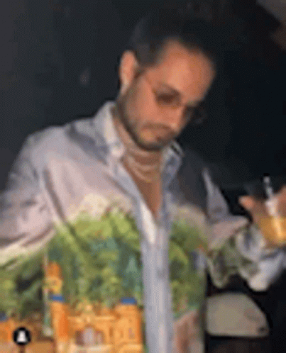 Man With Painted Shirt Holding Wine GIF