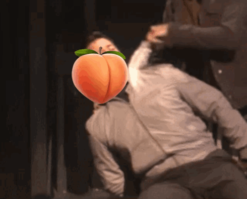Man With Peach Face Being Attacked GIF