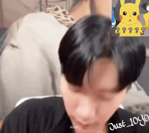 Man With Pikachu Sticker on Forehead