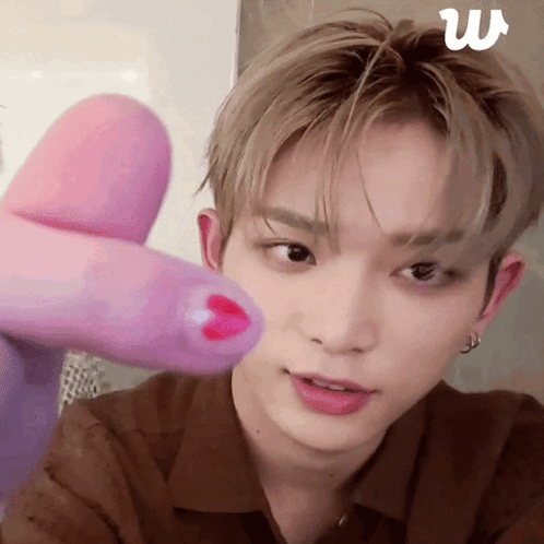Man With Pink Finger on Face