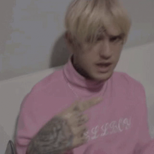 Man With Pink Hair And Face Tattoo GIF