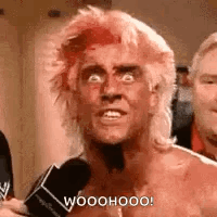 Man with Pink Hair Talking Into Microphone