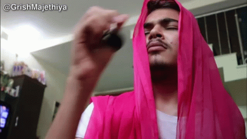 Man With Pink Scarf Holding Key