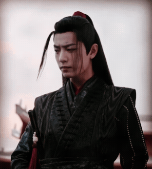 Man with Ponytail Wearing Black Jacket