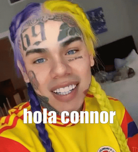 Man with Purple and Yellow Hair Saying Hola Connor