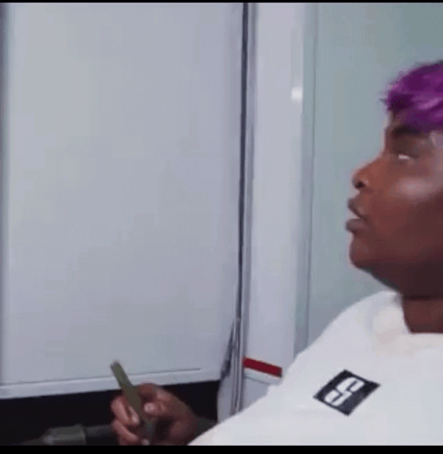 Man With Purple Hair Holding Lighter