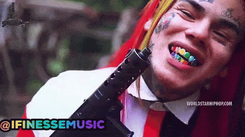 Man With Rainbow Teeth Holding Gun @ifinessemusic