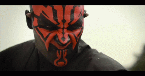 Man with Red and Black Face Paint and M