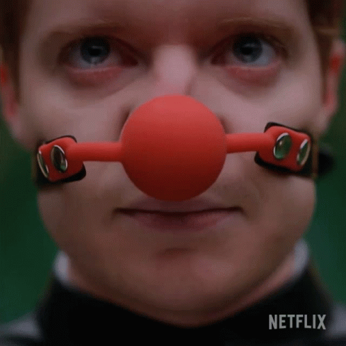 Man With Red Ball Gag on Nose and Netflix