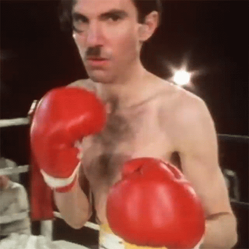 Man with Red Boxing Gloves and Mustache