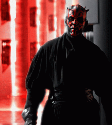 Man with Red Face and Horns in Black Robe