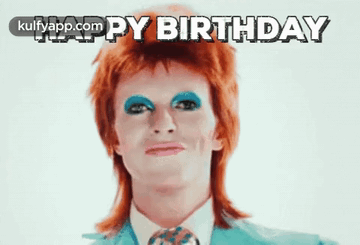 Man With Red Hair And Blue Eye Shadow Saying Happy Birthday GIF