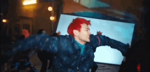 Man with Red Hair Dancing at Party