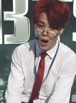 Man With Red Hair, Glasses, and Name Tag