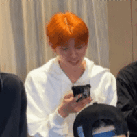 Man With Red Hair Holding Cell Phone