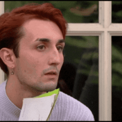Man with Red Hair Holding Paper
