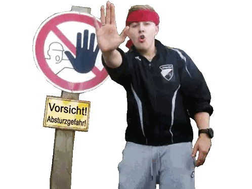 Man With Red Headband In Front Of Vorsicht Absturzgefahr Sign