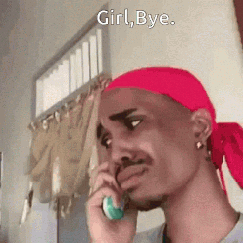 Man with Red Headband on Phone