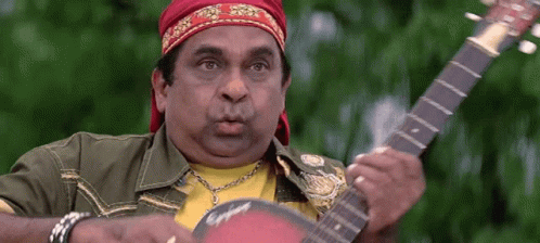 Man With Red Headband Playing Guitar GIF