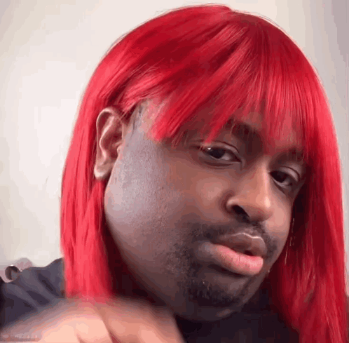 Man with Red Wig Making Funny Face