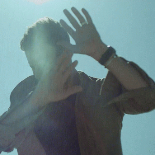 Man With Ring Covering Face GIF