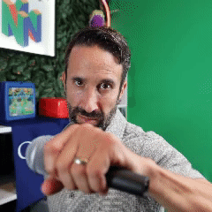 Man With Ring Holding Microphone GIF