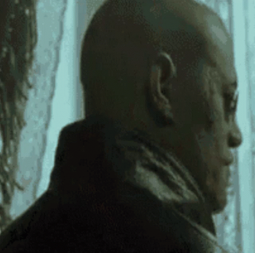 Man With Scar Looking Out Window GIF