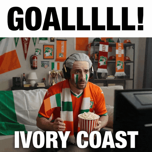 Man With Scarf Holding Popcorn Watching Ivory Coast GIF