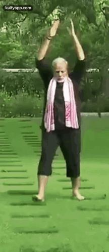 Man With Scarf on Green Field