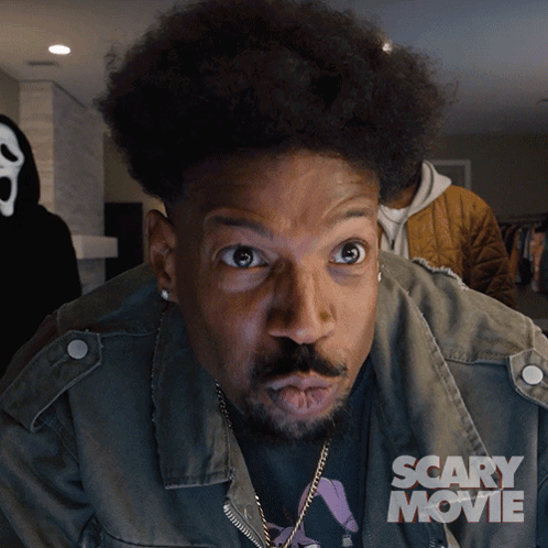 Man With Scary Movie Poster on Jacket