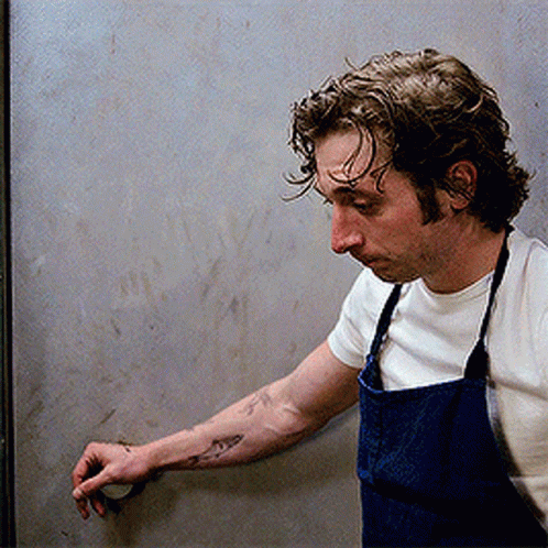 Man With Shark Tattoo And Apron GIF